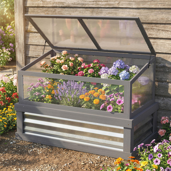 Cold frame with flowers in a garden setting